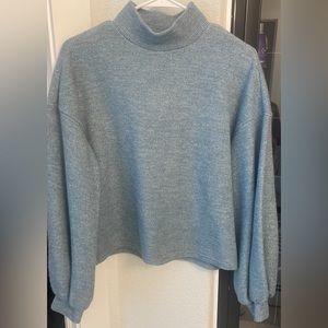 blue turtleneck sweater